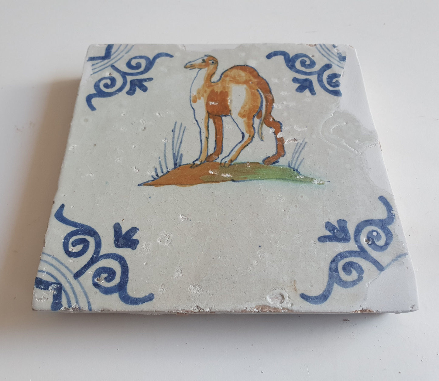 Antique Delft Tile – 17th Century Dromedary, Oxhead Corner Motifs