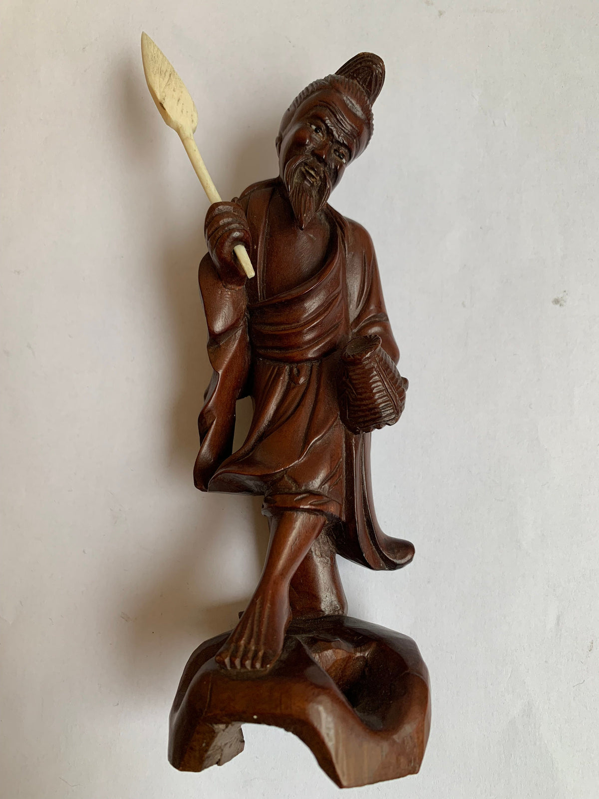 Hand-carved wooden statue of a fisherman - porcelain, early 20th century