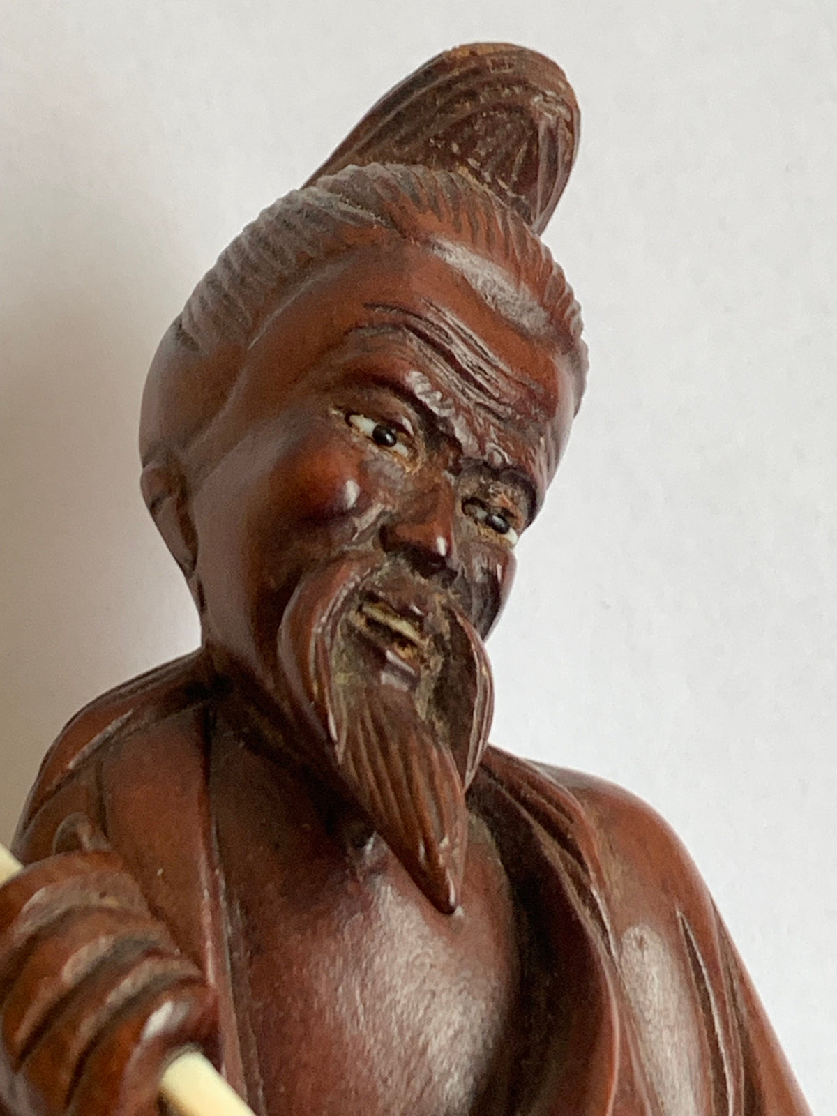 Hand-carved wooden statue of a fisherman - porcelain, early 20th century