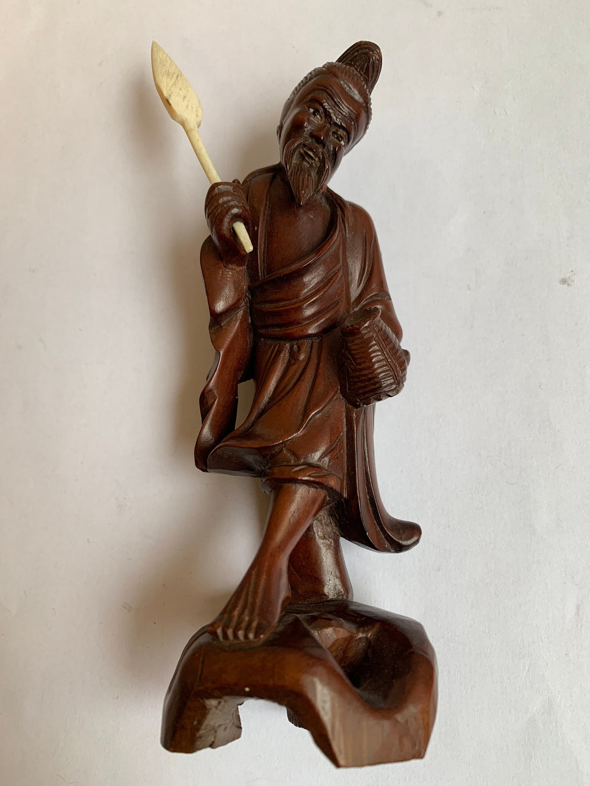 Hand-carved wooden statue of a fisherman - porcelain, early 20th century