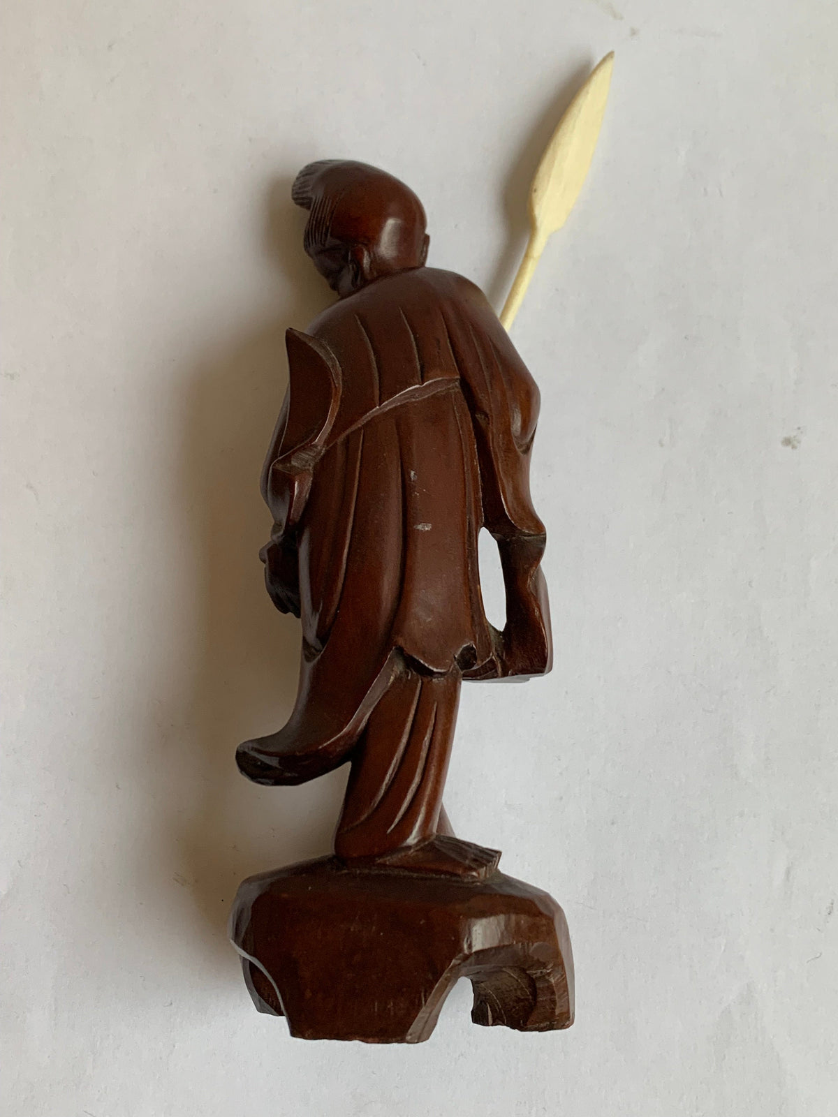 Hand-carved wooden statue of a fisherman - porcelain, early 20th century