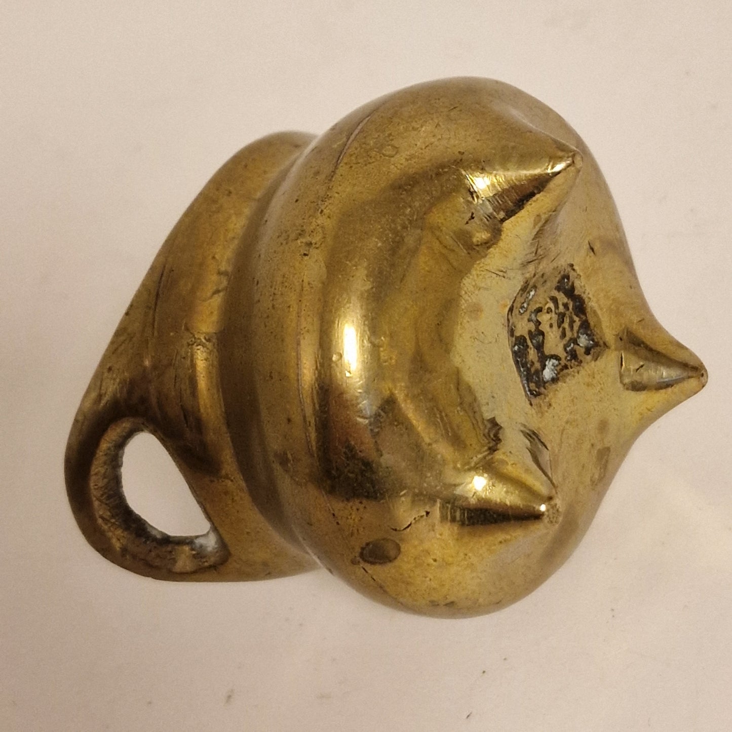 A Chinese bronze tripod censer, of typical shallow rounded form, supported on three short legs, the base with an apocryphal character mark