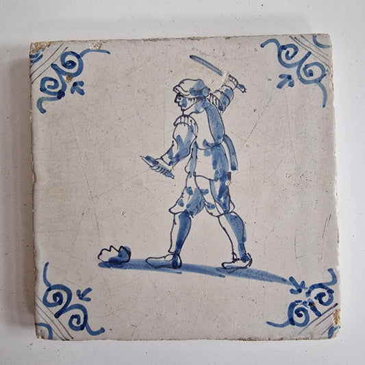 Antique Dutch Tile - man with knife  - Dated 1640, oxhead corner