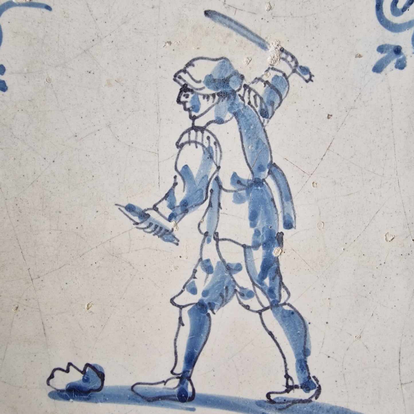 Antique Dutch Tile - man with knife  - Dated 1640, oxhead corner