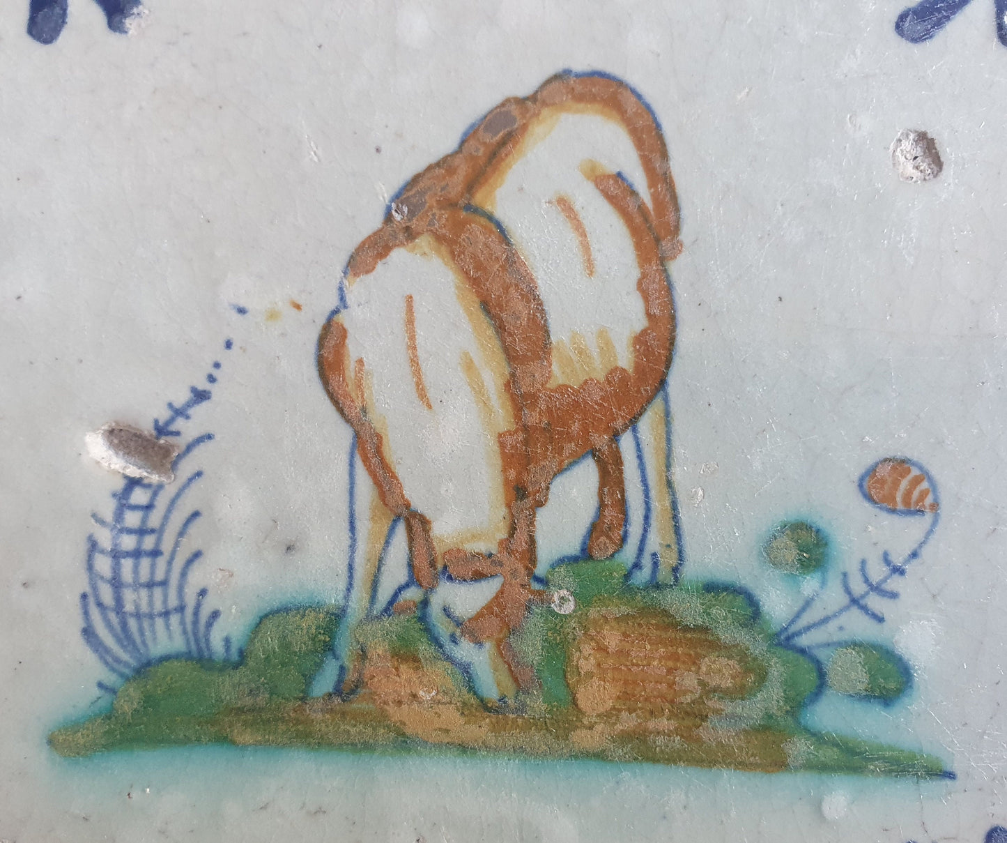 Antique Dutch Delft Tile – Sheep Motif, Polychrome Oxhead Corner, 17th Century