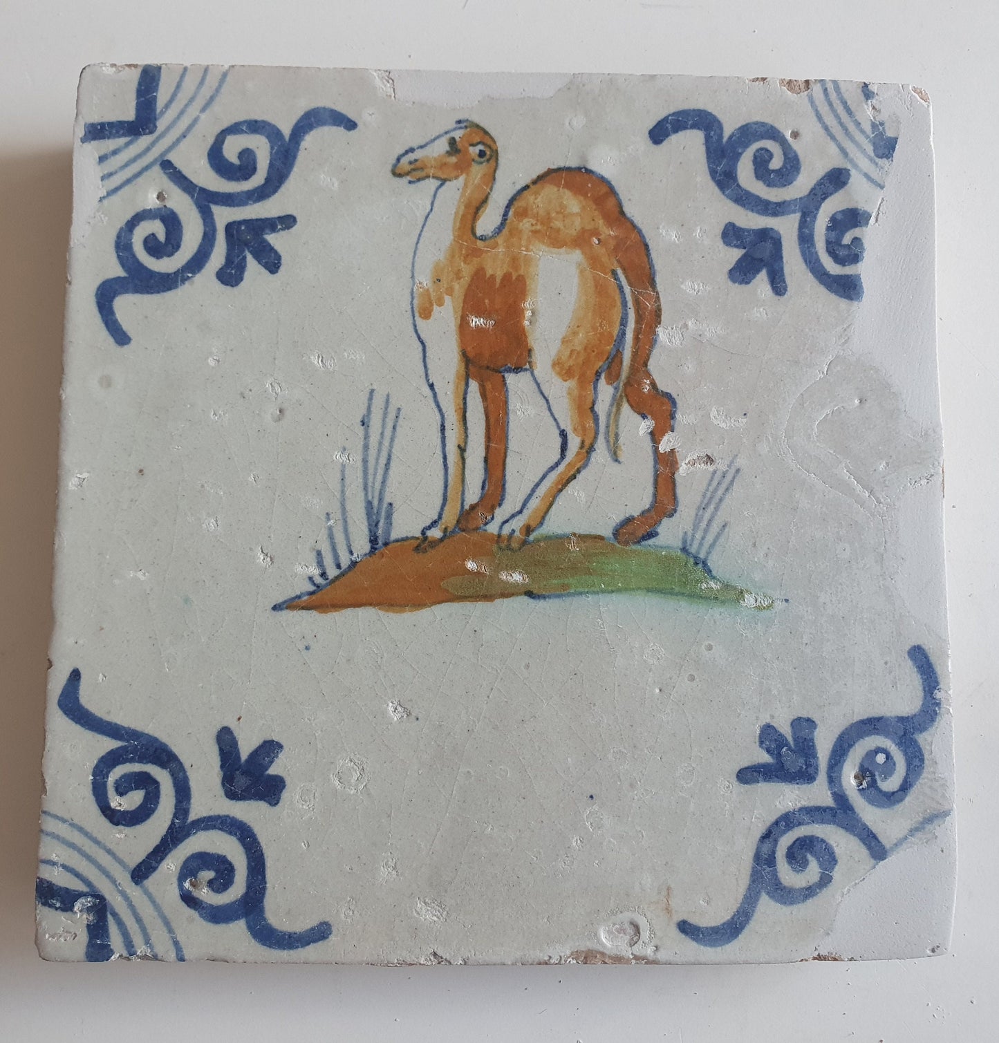 Antique Delft Tile – 17th Century Dromedary, Oxhead Corner Motifs