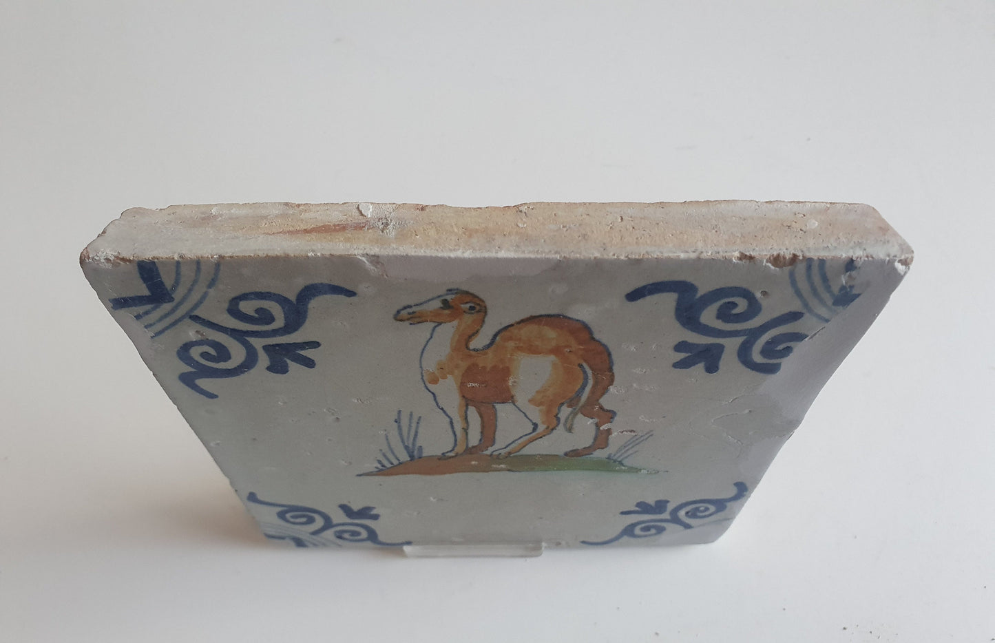 Antique Delft Tile – 17th Century Dromedary, Oxhead Corner Motifs