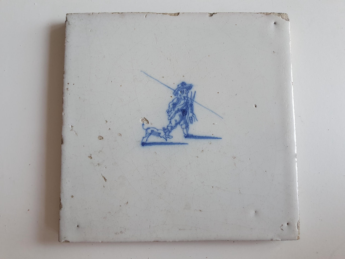 Antique Dutch tile with hunter, dog and hare around 1700 hunting scene