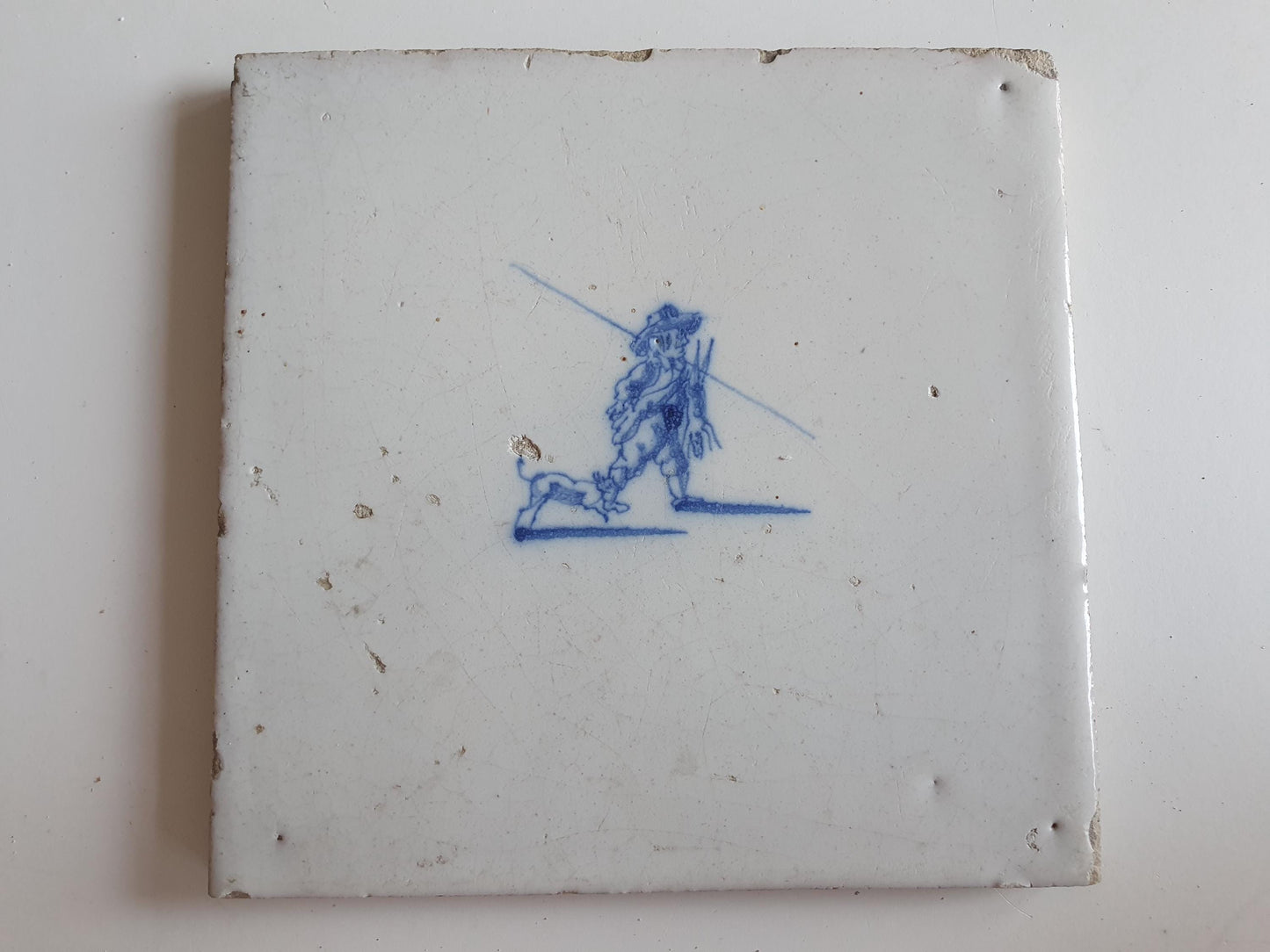 Antique Dutch tile with hunter, dog and hare around 1700 hunting scene