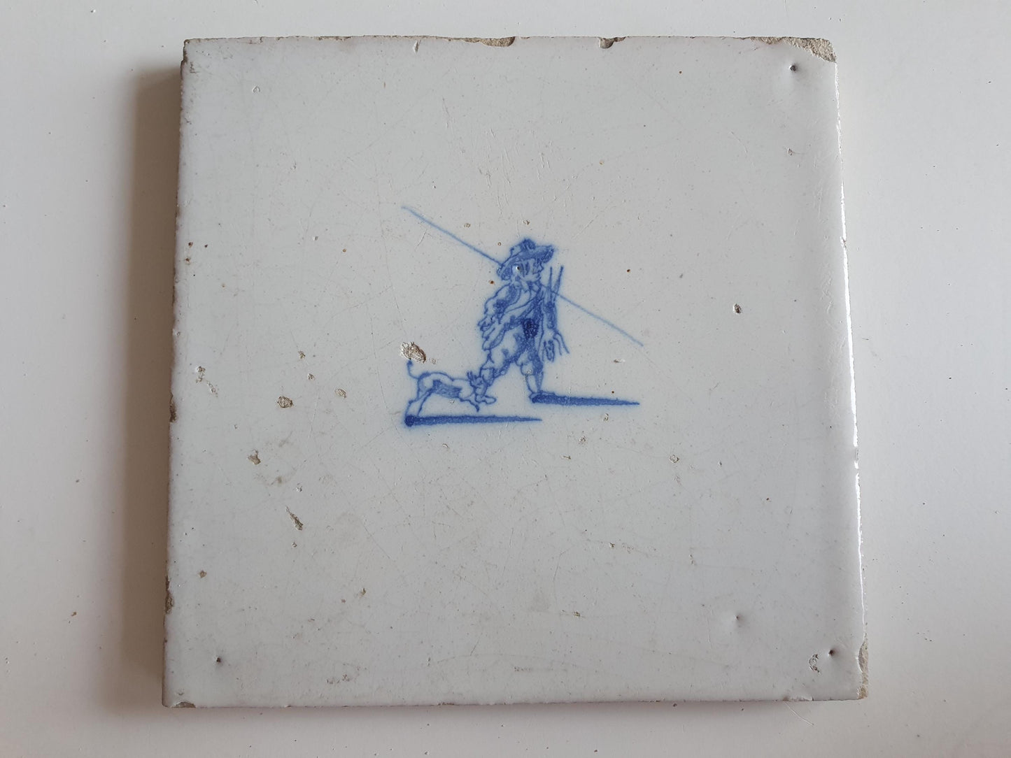 Antique Dutch tile with hunter, dog and hare around 1700 hunting scene