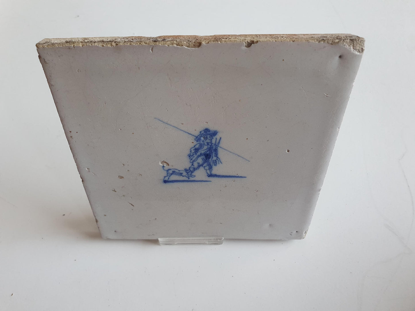 Antique Dutch tile with hunter, dog and hare around 1700 hunting scene