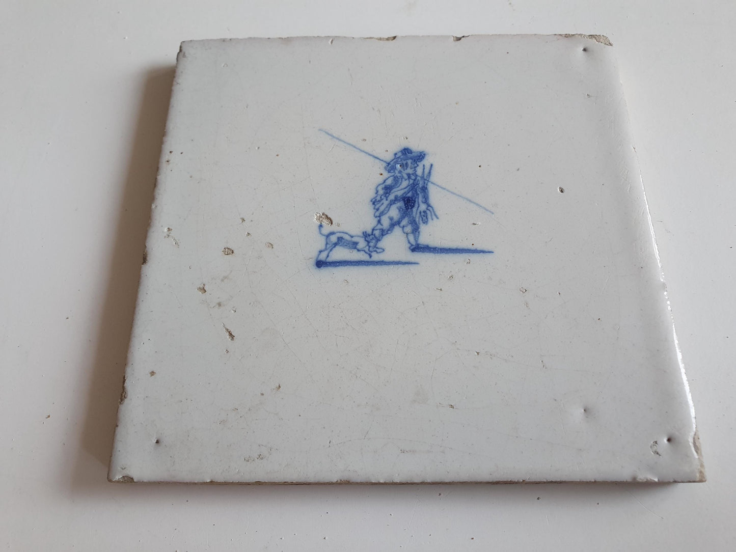 Antique Dutch tile with hunter, dog and hare around 1700 hunting scene