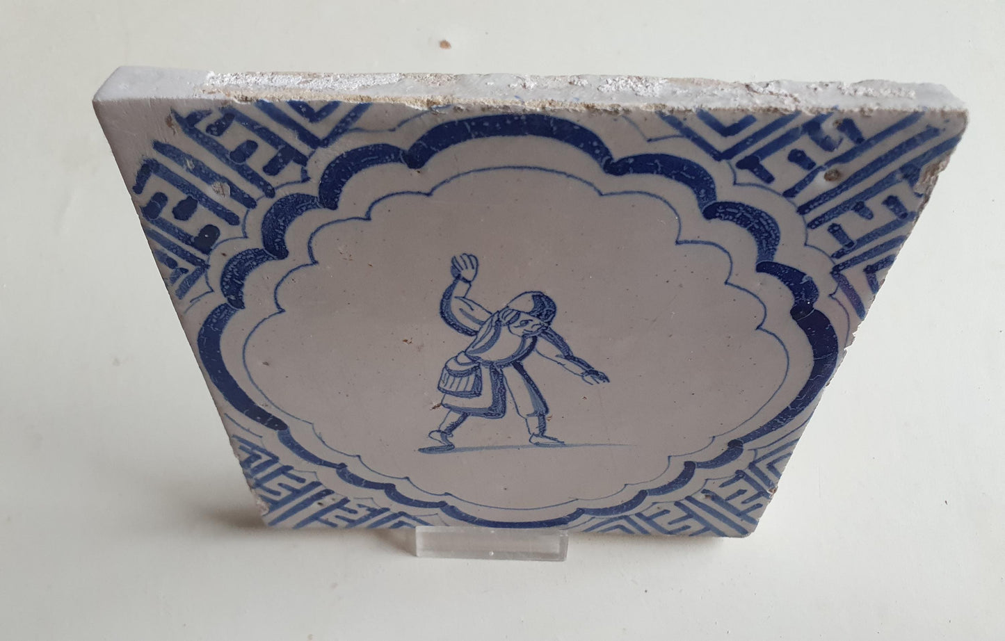 Antique Dutch Delft Blue Tile - representation of a dancer with a meander shape - Dated around 1640
