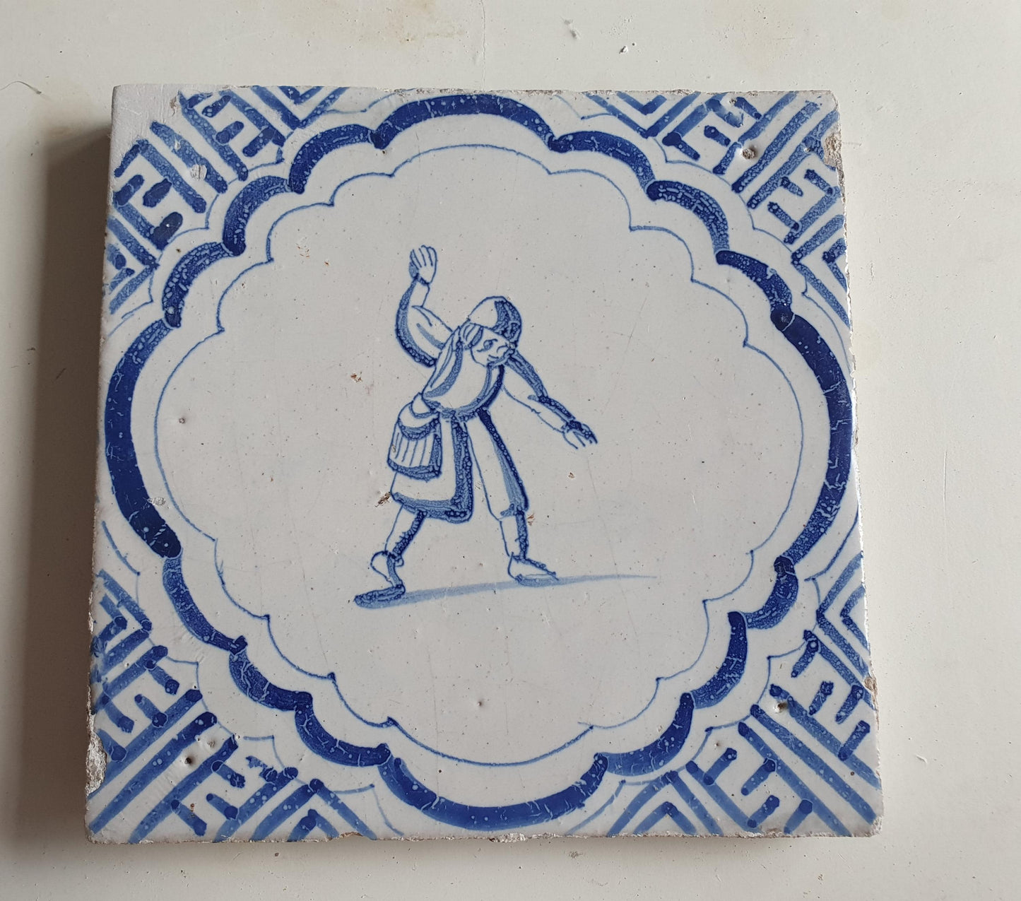 Antique Dutch Delft Blue Tile - representation of a dancer with a meander shape - Dated around 1640