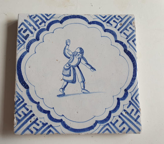 Antique Dutch Delft Blue Tile - representation of a dancer with a meander shape - Dated around 1640