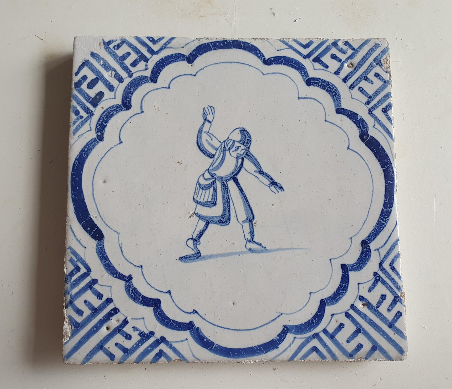 Antique Dutch Delft Blue Tile - representation of a dancer with a meander shape - Dated around 1640