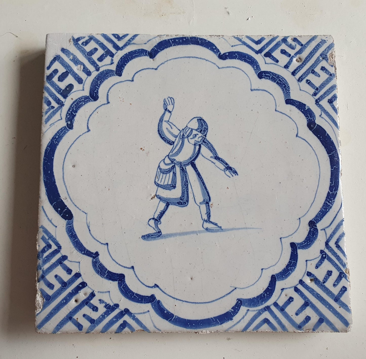 Antique Dutch Delft Blue Tile - representation of a dancer with a meander shape - Dated around 1640