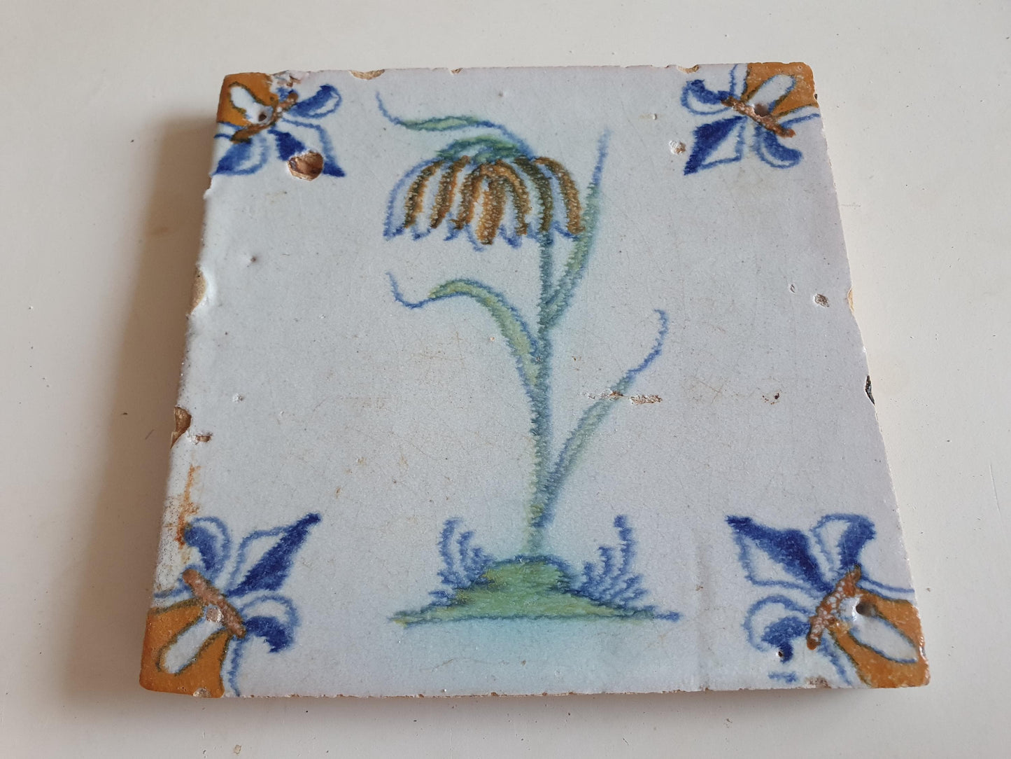 dutch flower  Gouda rare delft polychrome tile, 1620