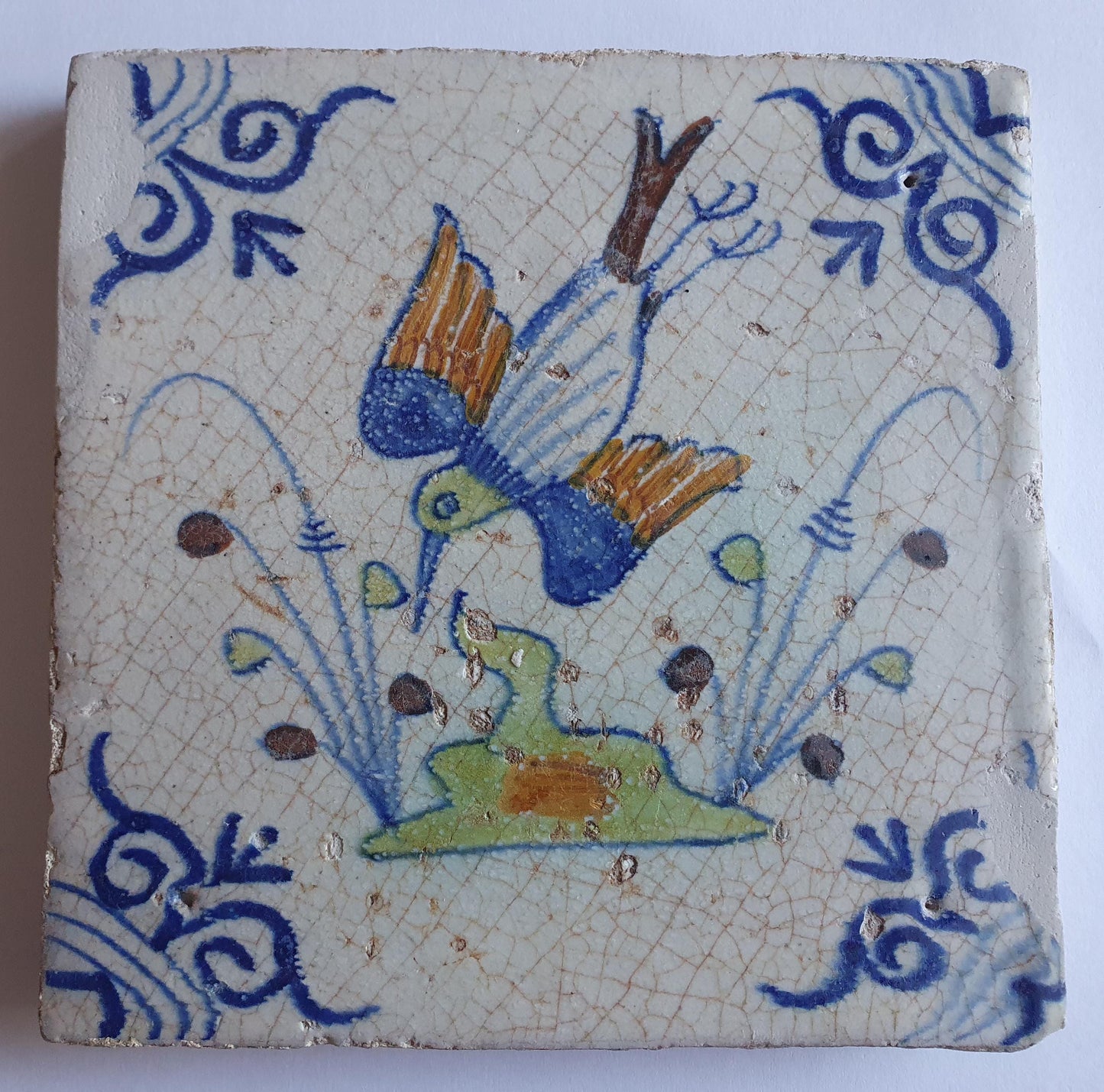 Antique Delft Tile – Polychrome Bird, Oxhead Motif (circa 1630)