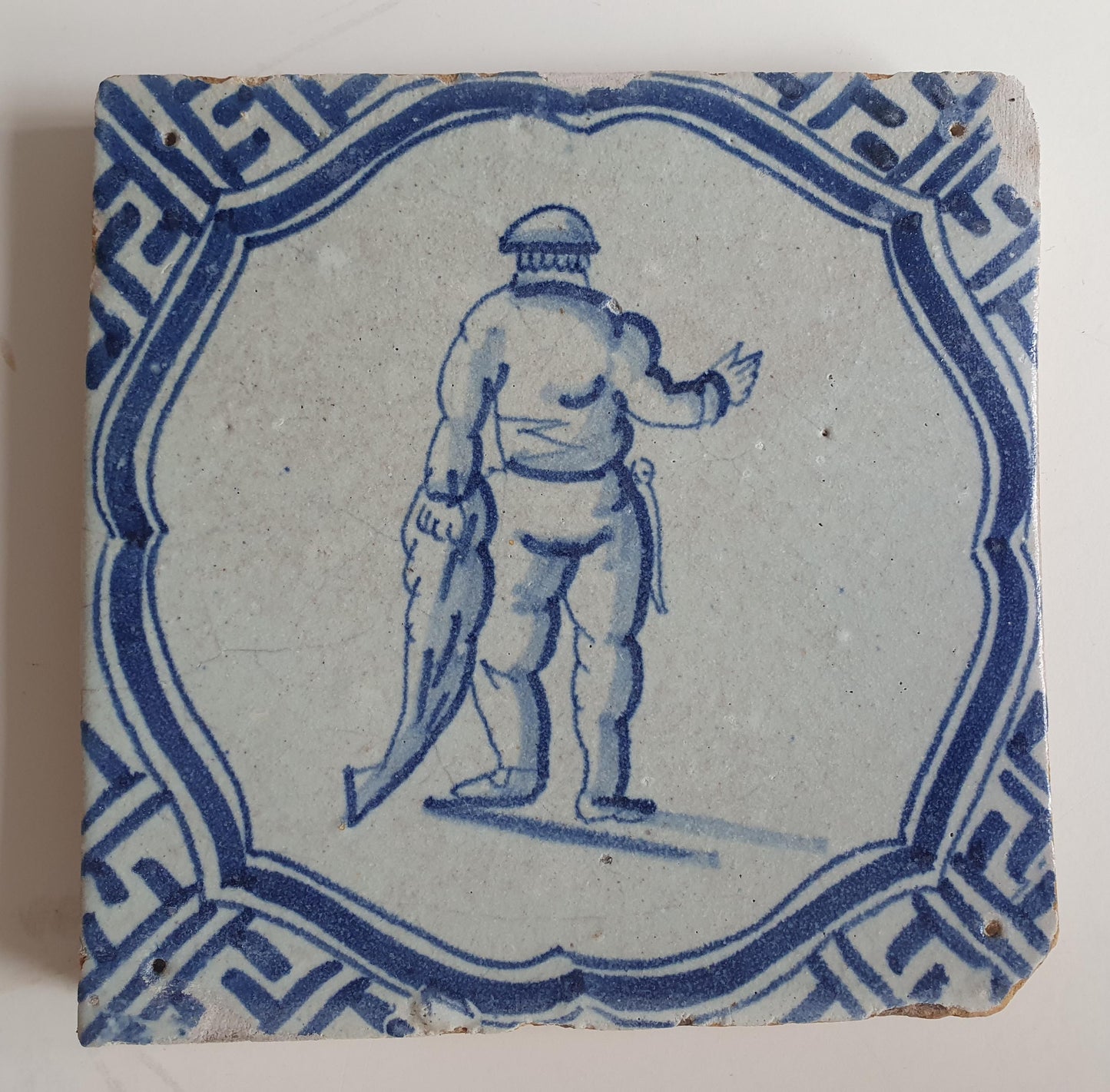 Antique Dutch Tile - fisherman in scalloped frame with meander - Dated 1620-1650,  delft tegel