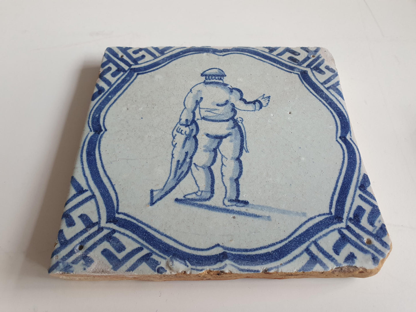 Antique Dutch Tile - fisherman in scalloped frame with meander - Dated 1620-1650,  delft tegel