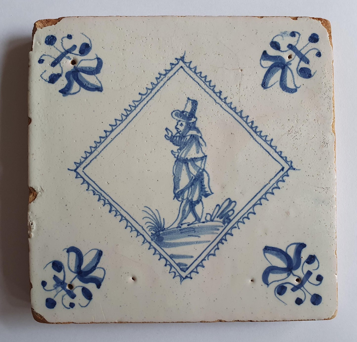 Dutch 17th  antique Delft tile, tegel, gentleman, RARE, lilyhead corner, around 1620