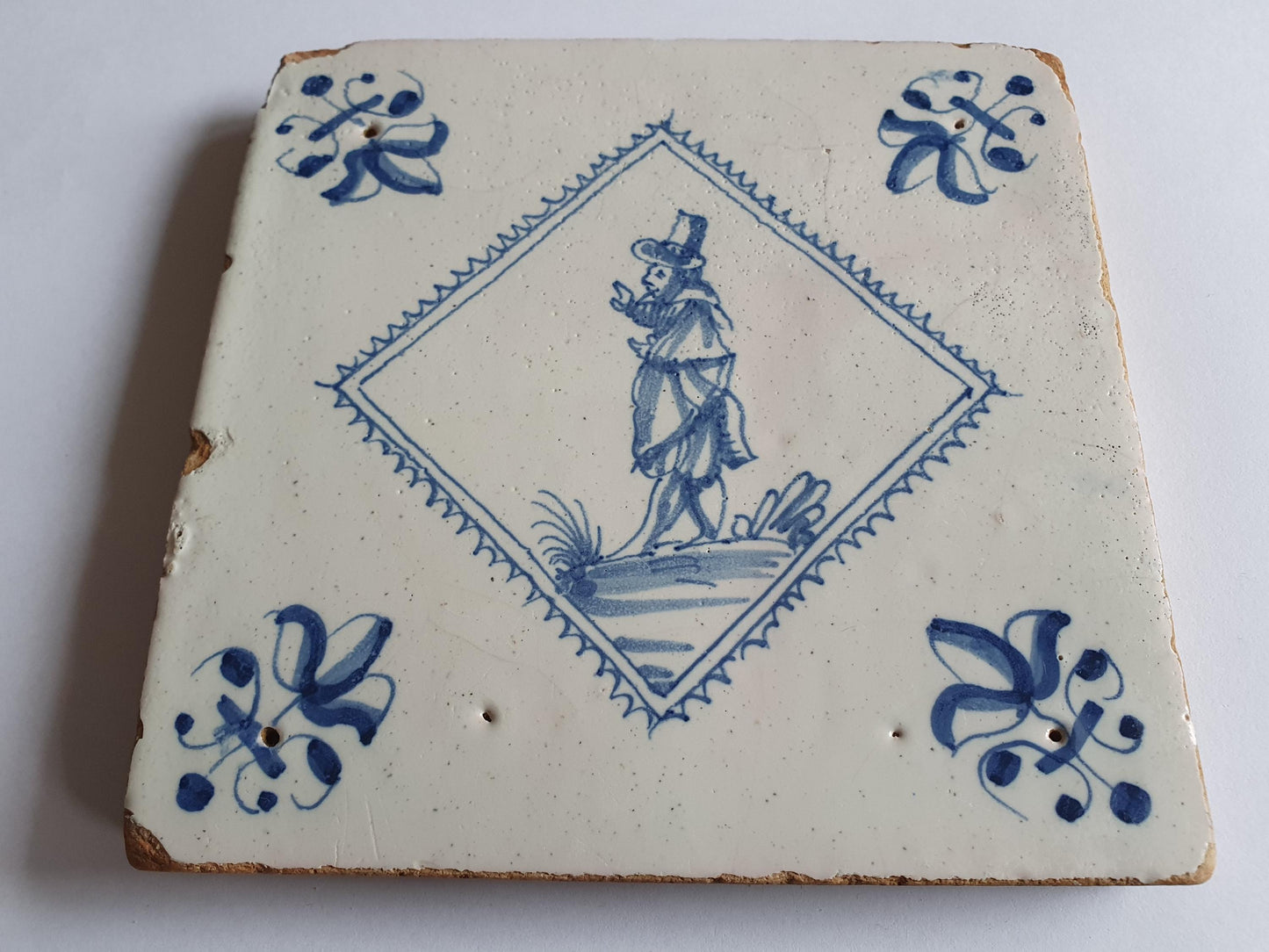 Dutch 17th  antique Delft tile, tegel, gentleman, RARE, lilyhead corner, around 1620