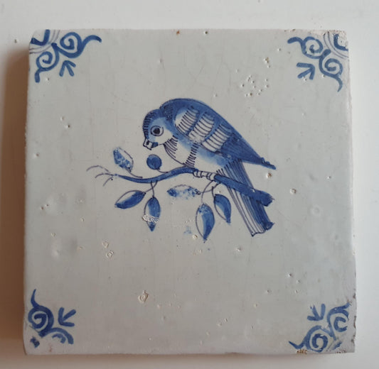 17th century Antique Dutch Tile bird with oxhead corner motive delft blue holland tile