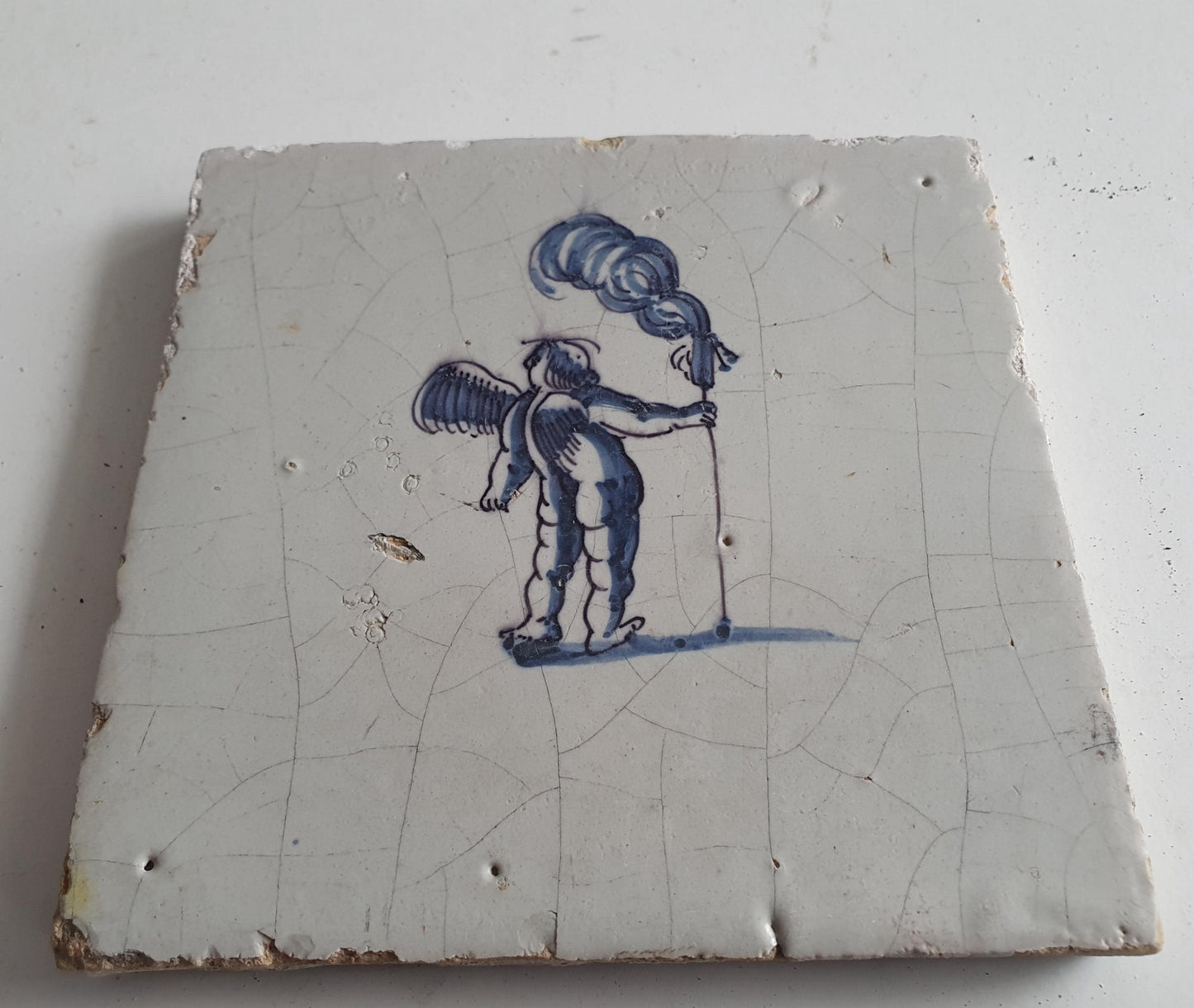 Antique Dutch Tile -  angel with ?  - Dated 1700, , delft blue , holland 17th century