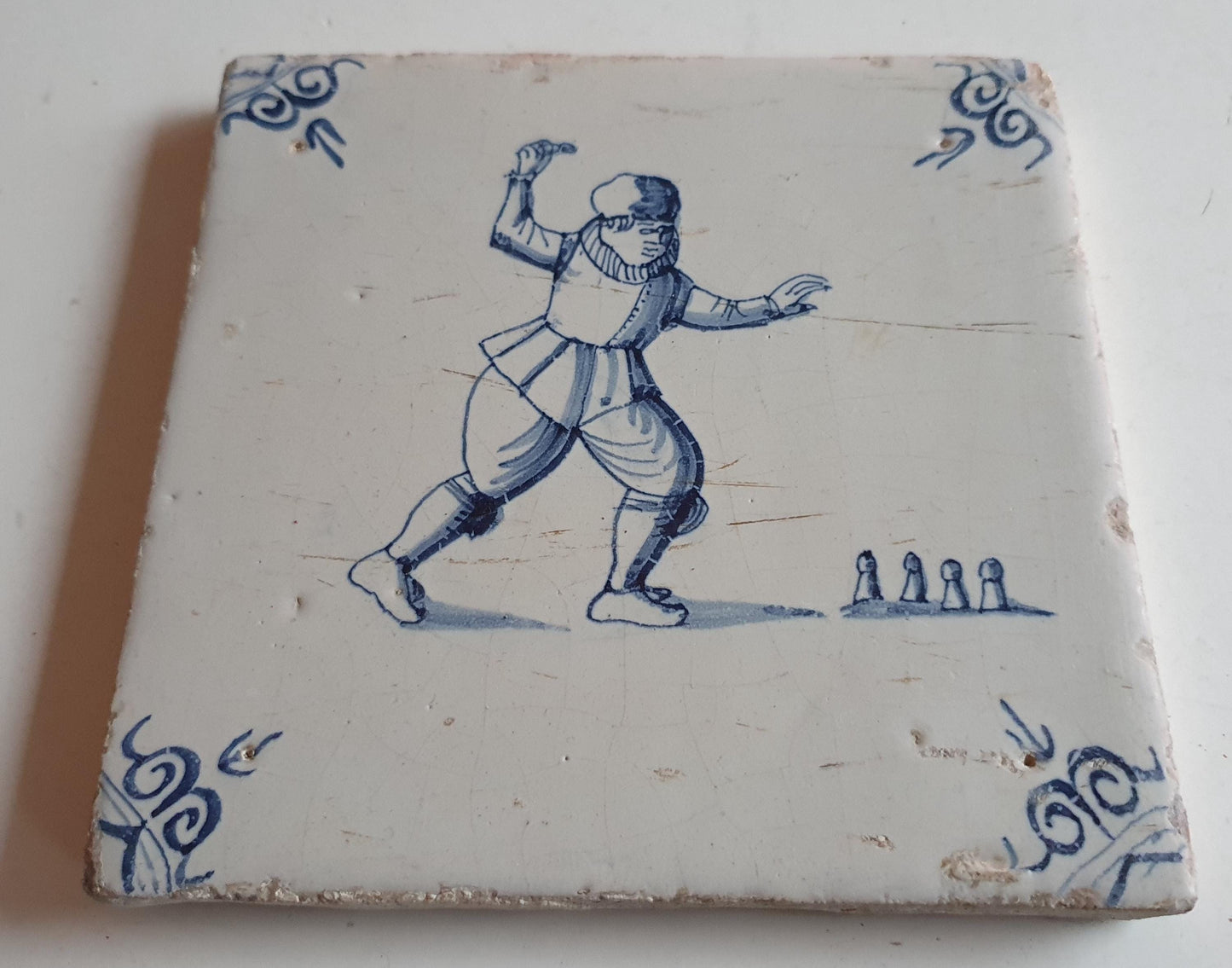Antique Dutch Tile - child,s play  - Dated 1640, oxhead corner