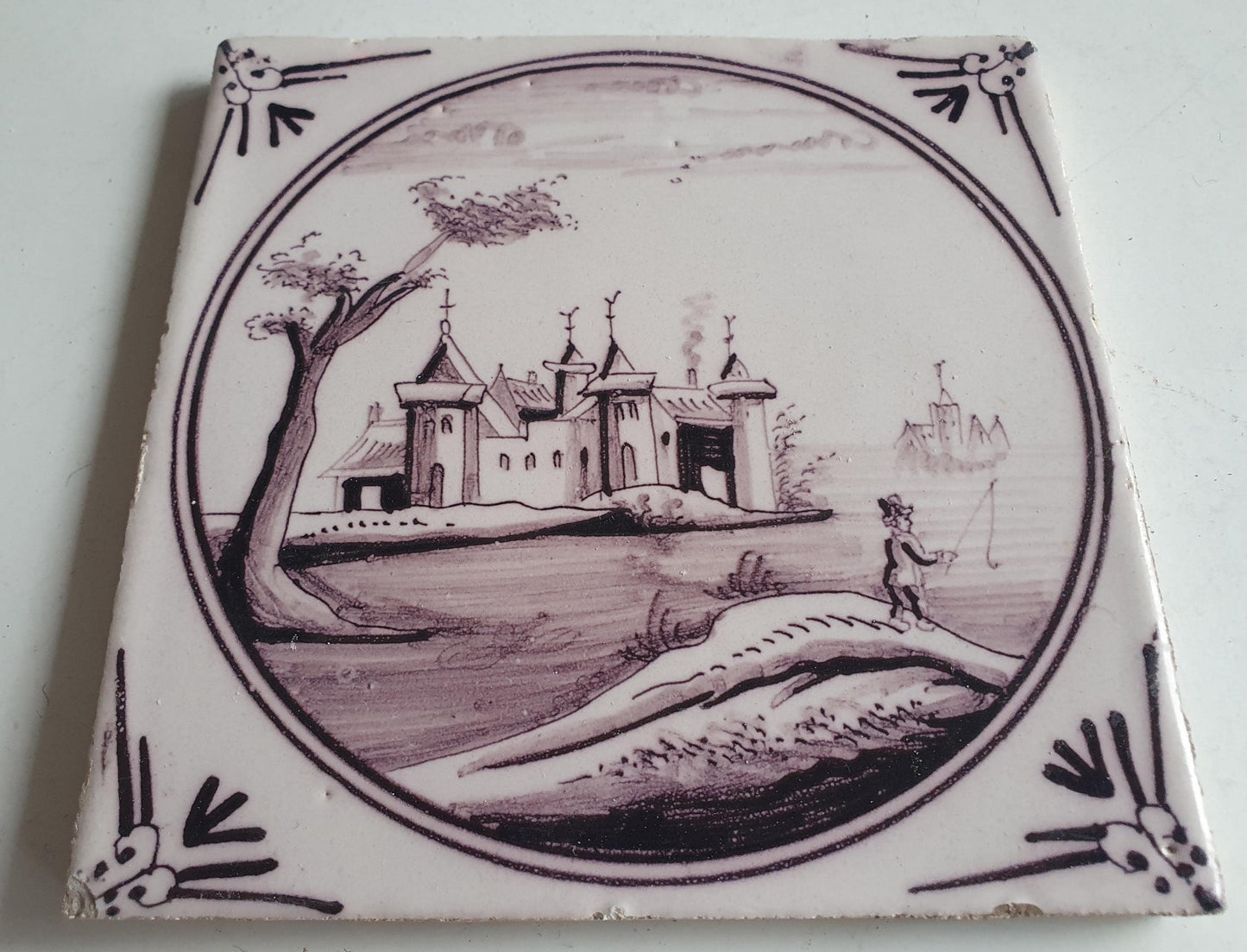 Around 1850 century Antique Dutch Tile - manganese landscape tegel castle with fischerman