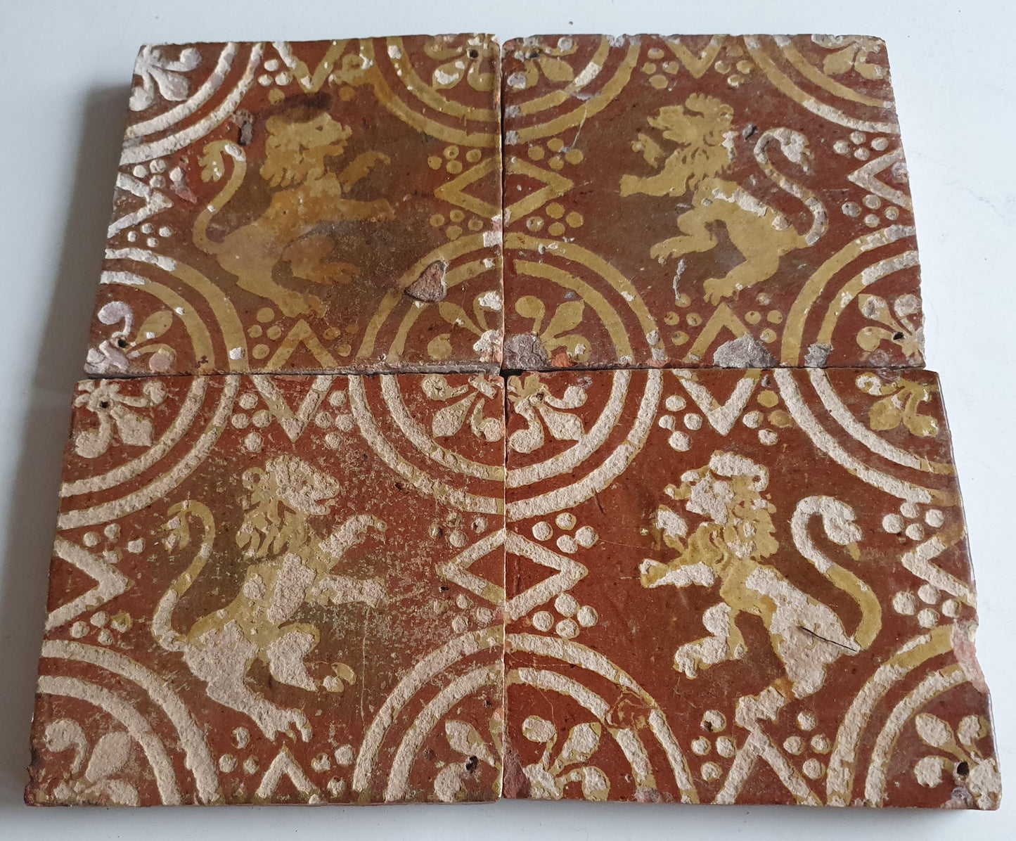 4 x 18th century Antique  Tile lion with lilyhead corner motive