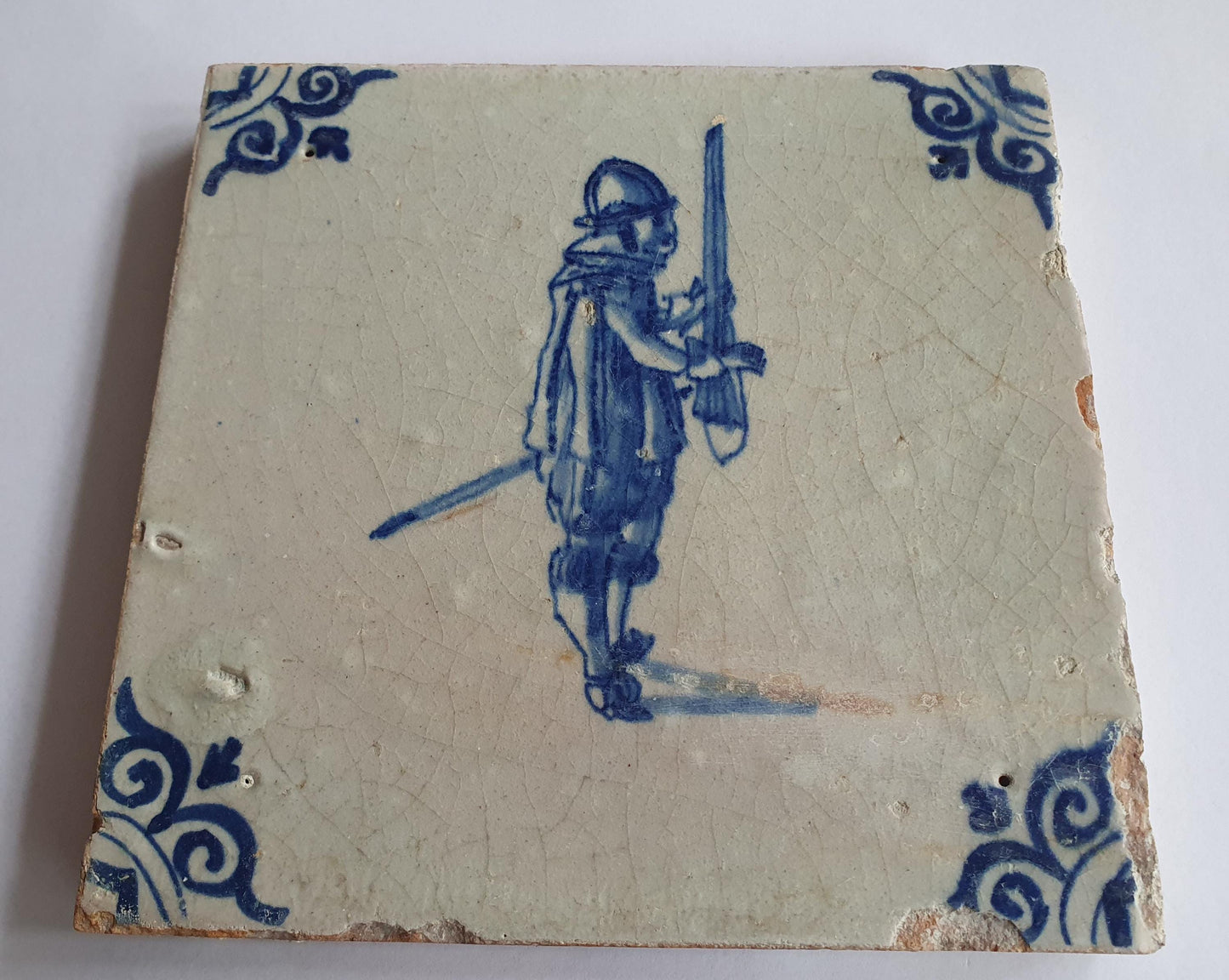 Antique Delft Tile - 17th Century Dutch Soldier, Oxhead Corner