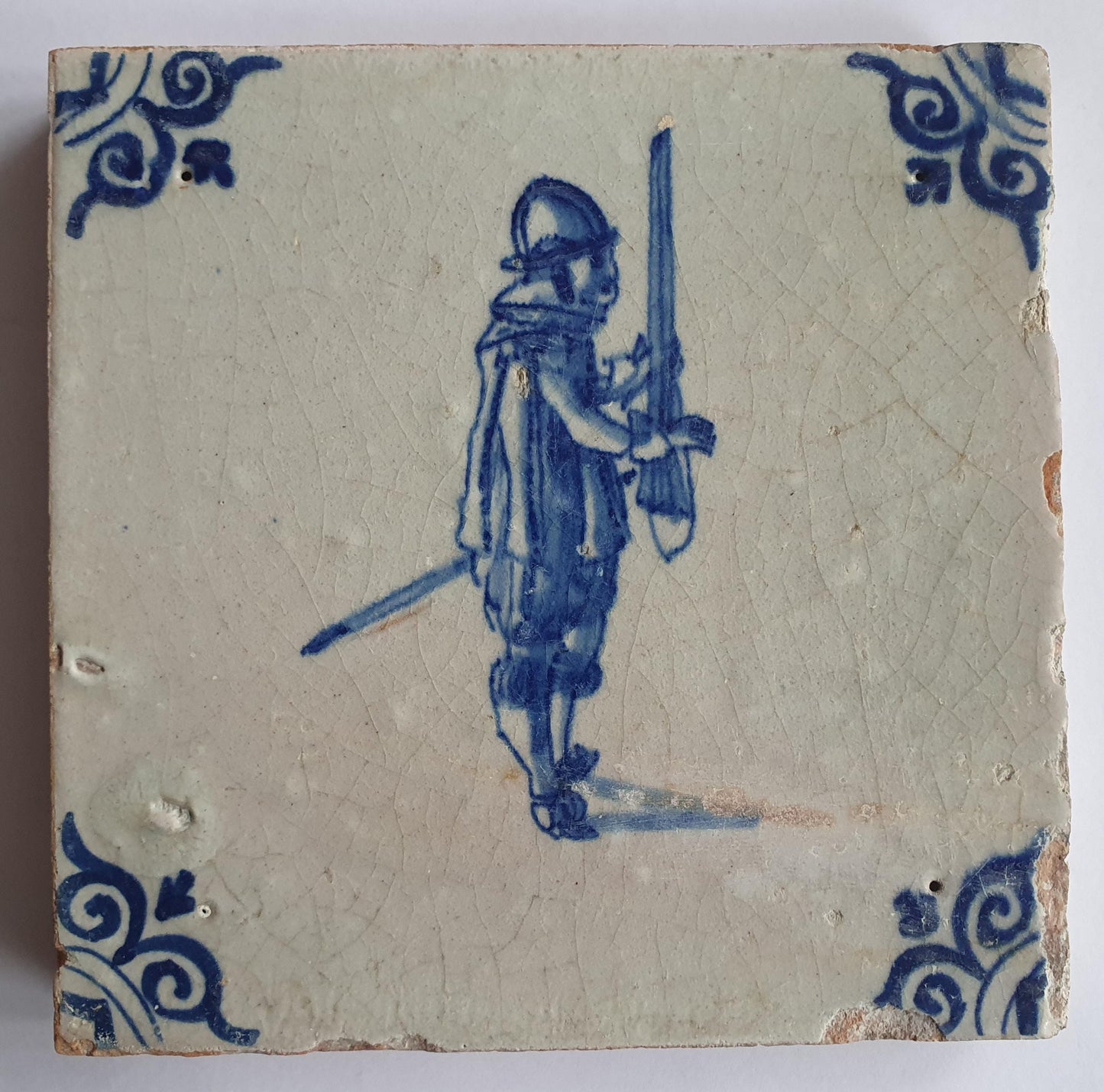 Antique Delft Tile - 17th Century Dutch Soldier, Oxhead Corner