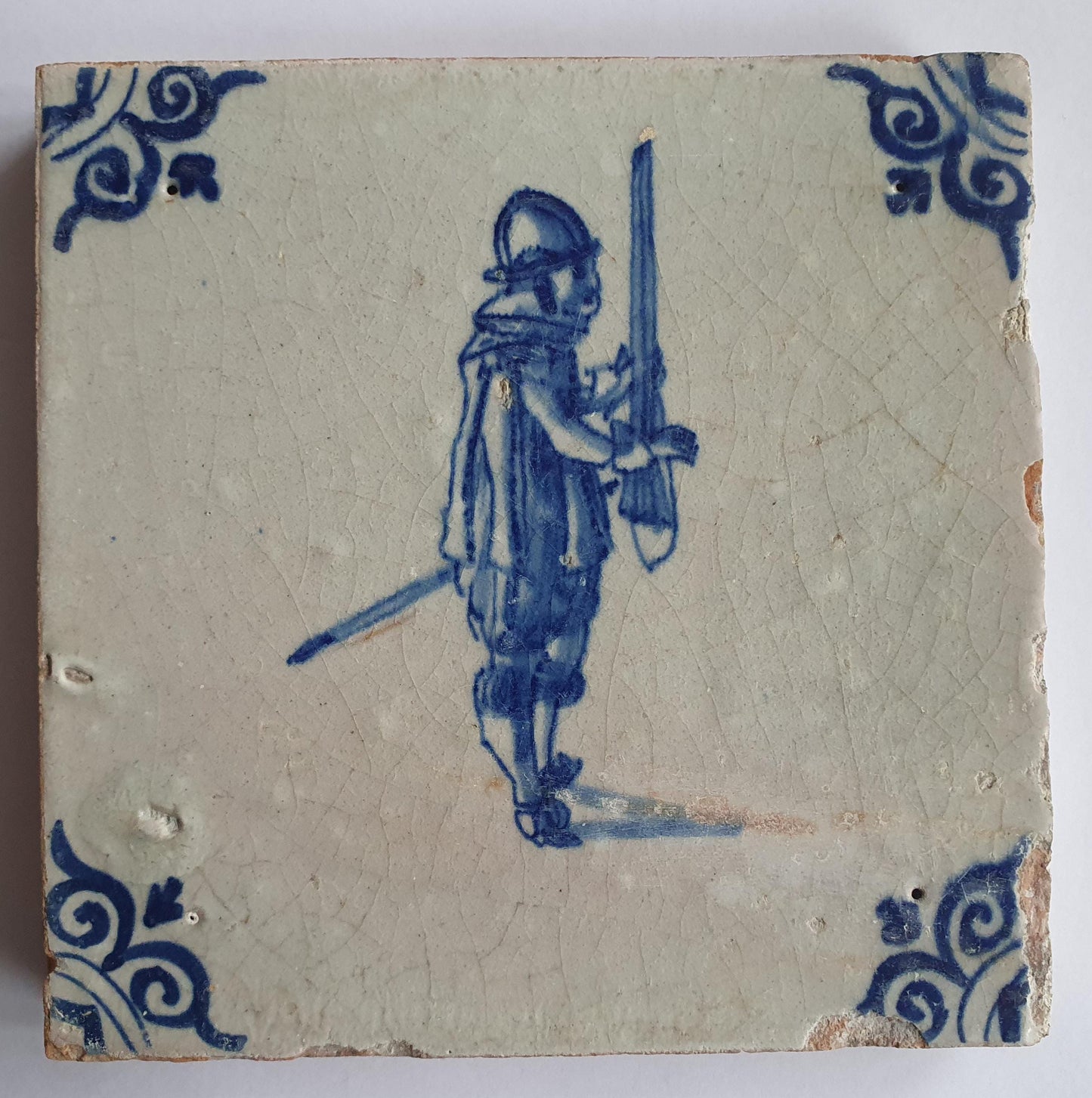 Antique Delft Tile - 17th Century Dutch Soldier, Oxhead Corner