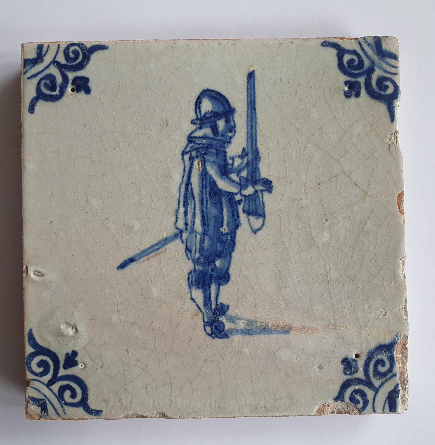 Antique Delft Tile - 17th Century Dutch Soldier, Oxhead Corner