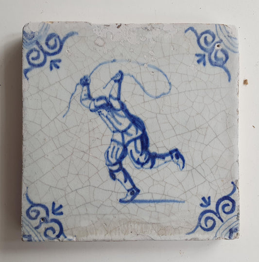 17th Delft tile was  made around 1650 and depicts a  child with a jumping rope.
