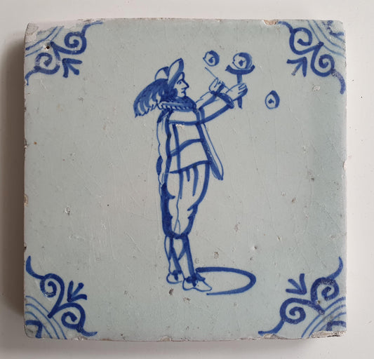 17th Century Delft Tile: Child Blowing Bubbles, Blue Ox-Head Motif