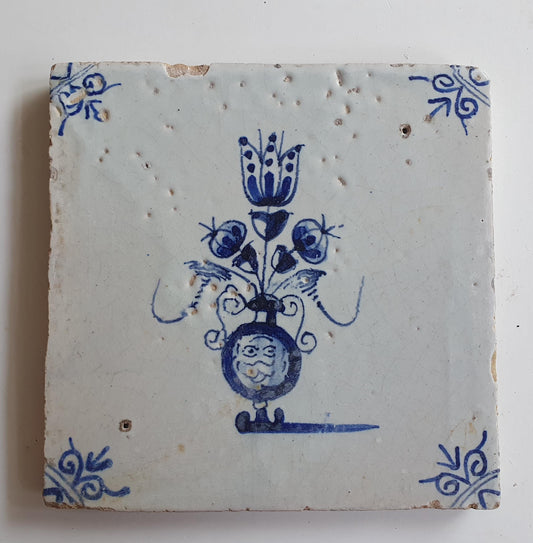 17th century Antique Dutch Tile flower with oxhead corner motive delft blue holland tile
