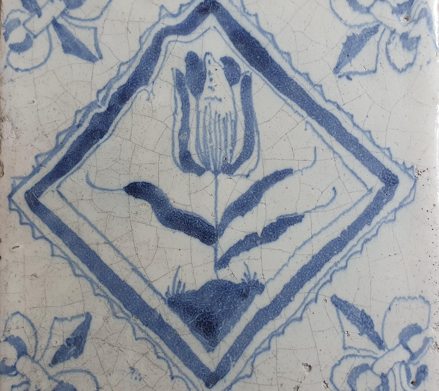 17th century Antique Dutch Tile flower with lilyhead corner motive delft blue holland tile