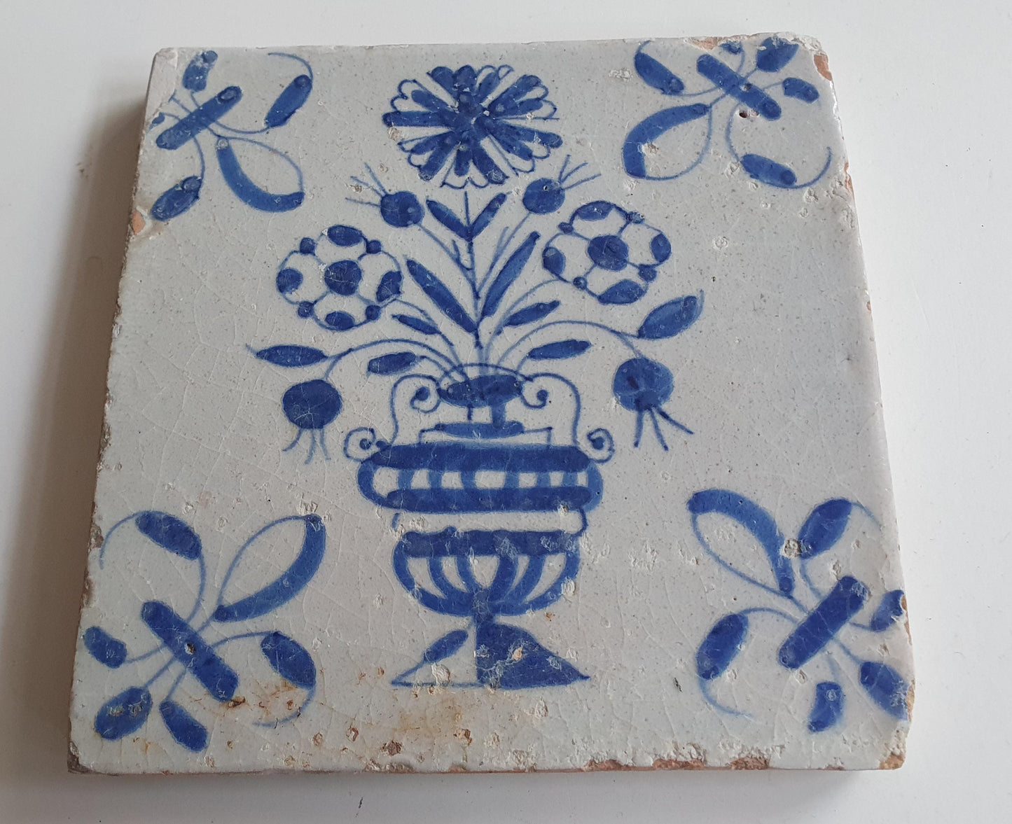 17th century Antique Dutch Tile flower with lilyhead corner motive delft blue holland tile