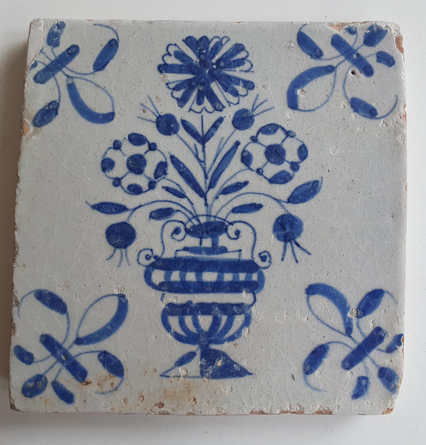 17th century Antique Dutch Tile flower with lilyhead corner motive delft blue holland tile