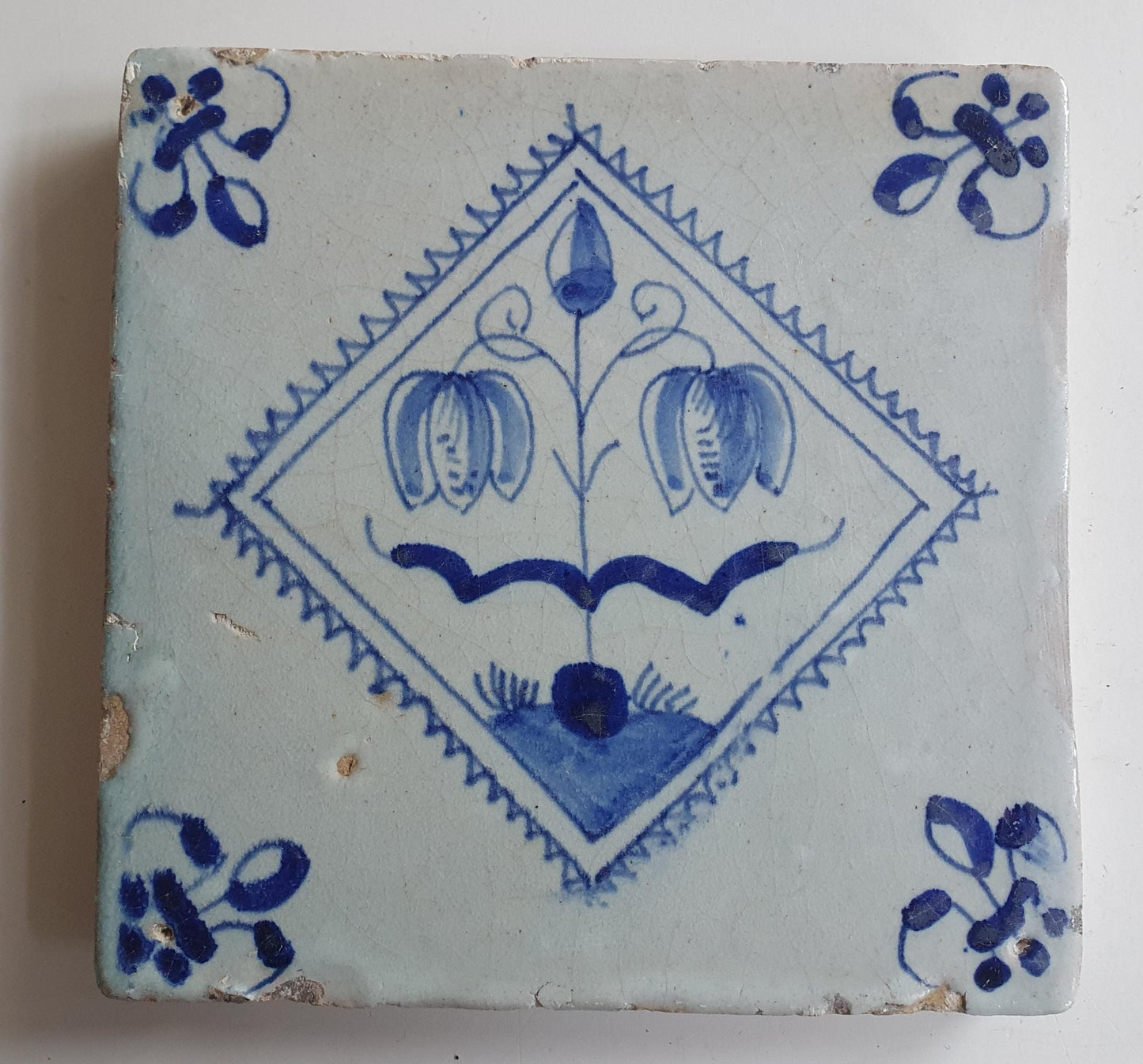 17th century Antique Dutch Tile flower with lilyhead corner motive delft blue holland tile