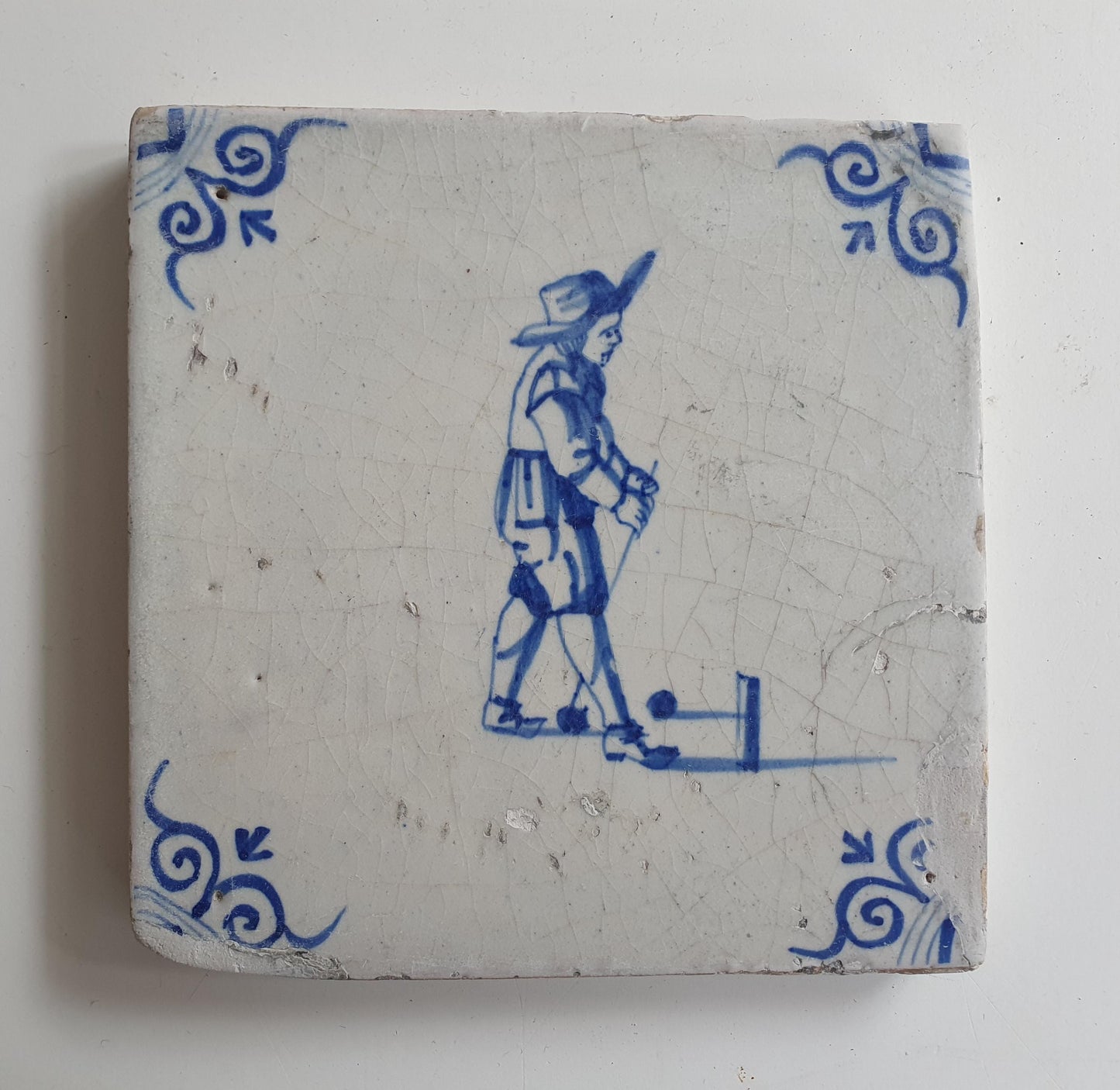 17th Delft tile was  made around 1650, with a golf player