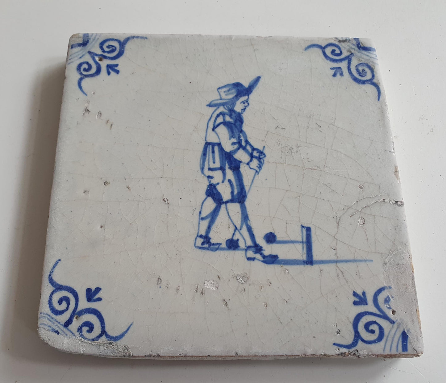 17th Delft tile was  made around 1650, with a golf player