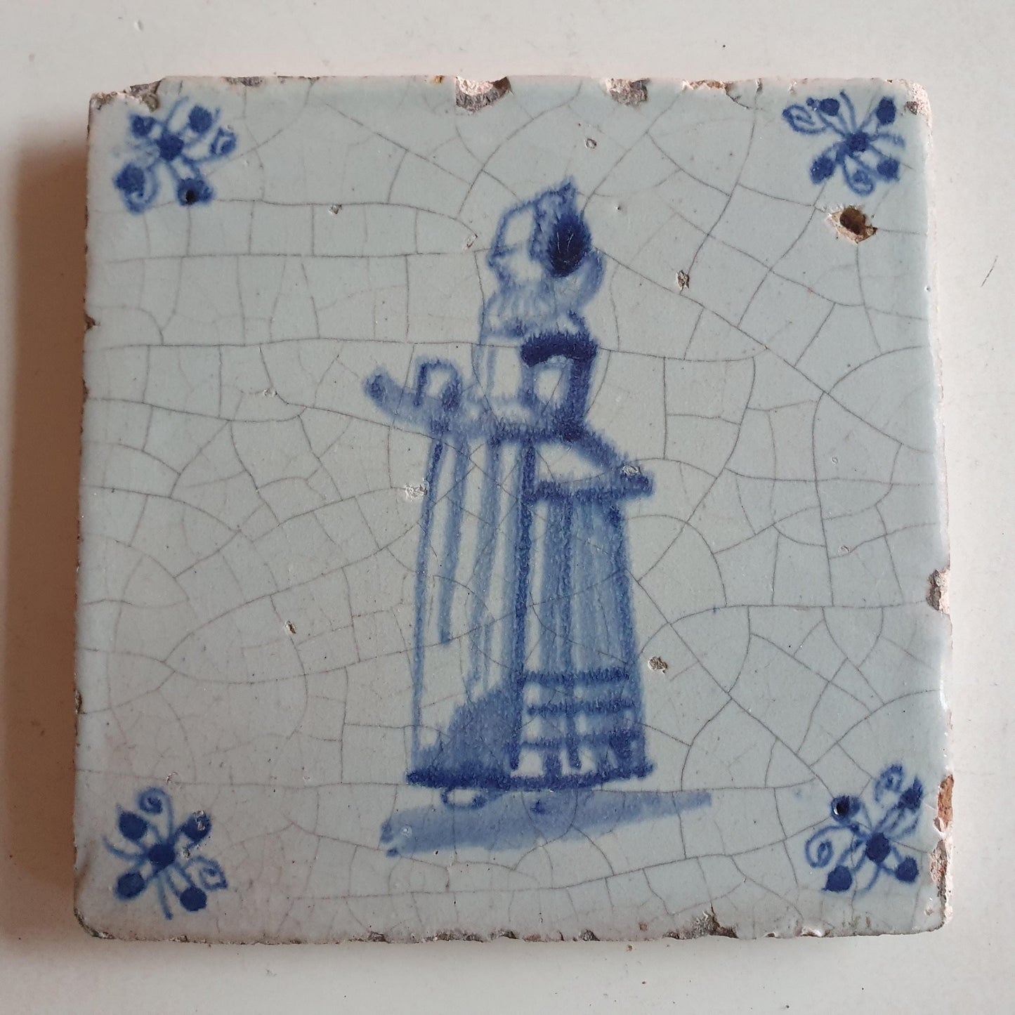 17th Delft tile was  made around 1650 with a lady