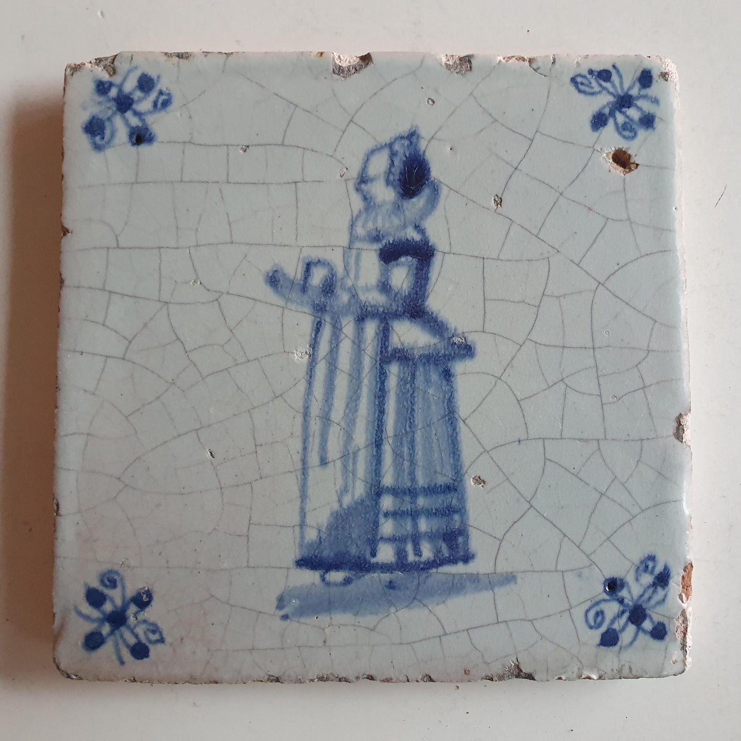 17th Delft tile was  made around 1650 with a lady