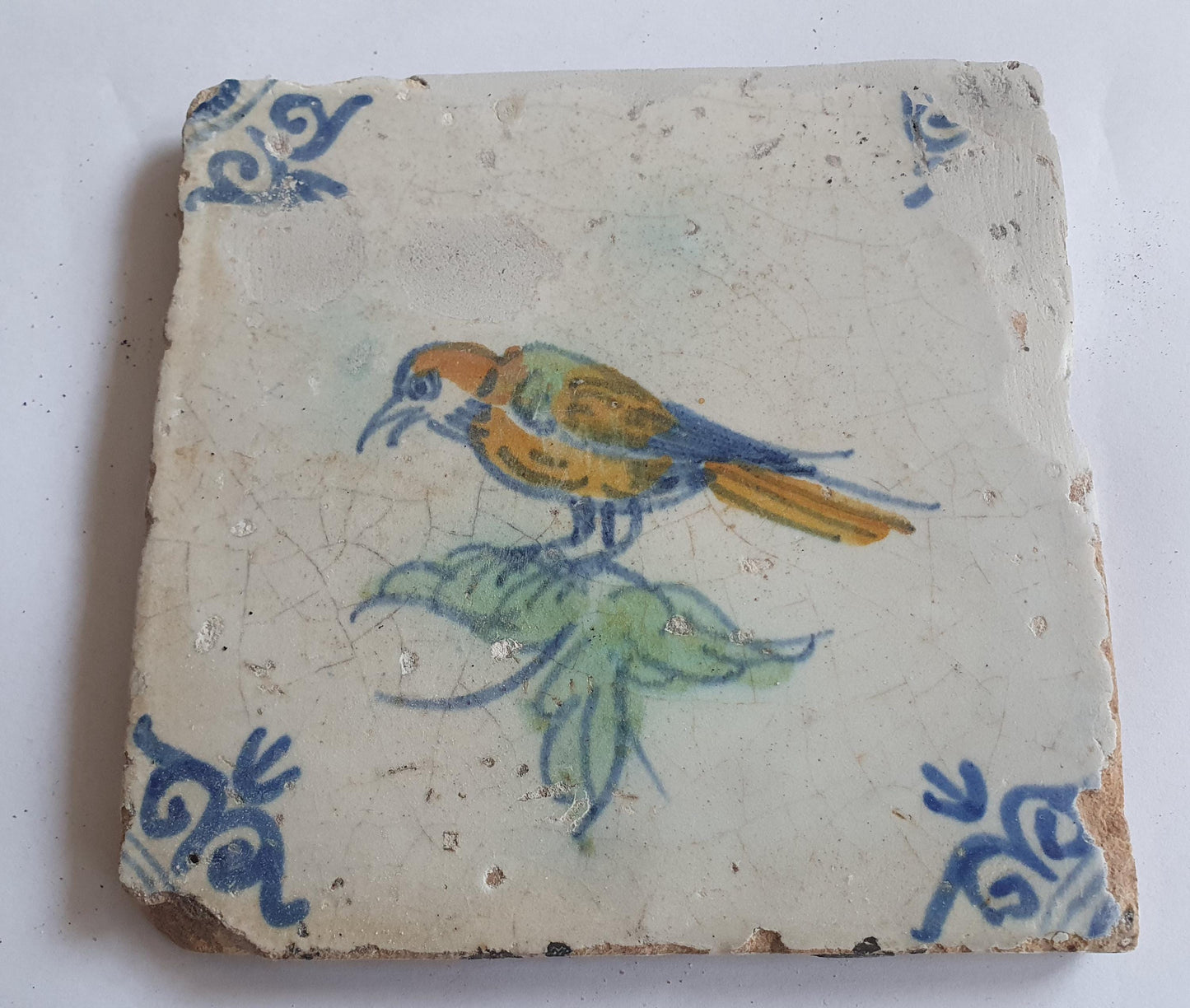Antique Dutch Delft Tile – Polychrome Bird, Oxhead Motif (c. 1640)