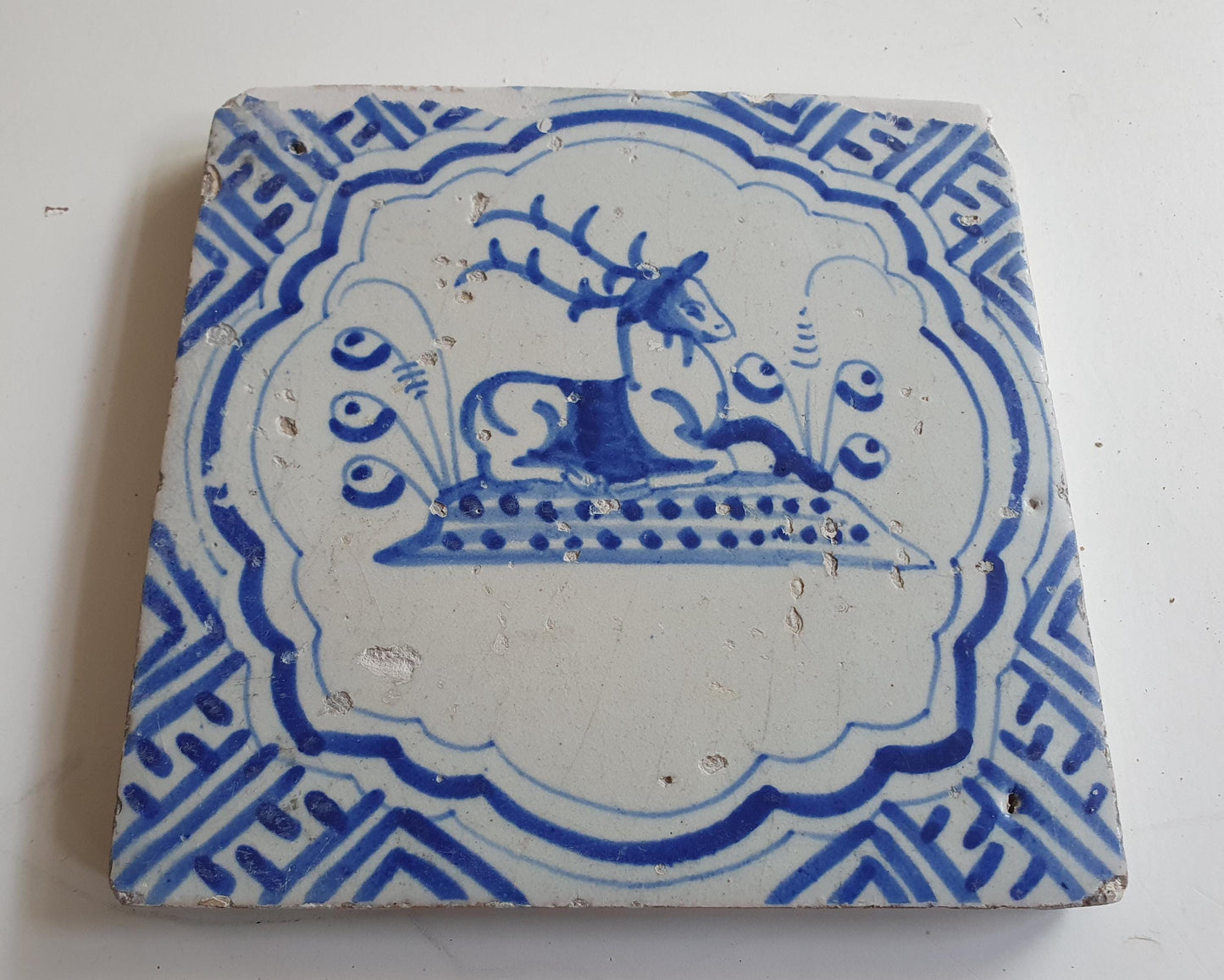 17th Antique Dutch Delft Blue Tile - deer with a meander shape - Dated around 1640