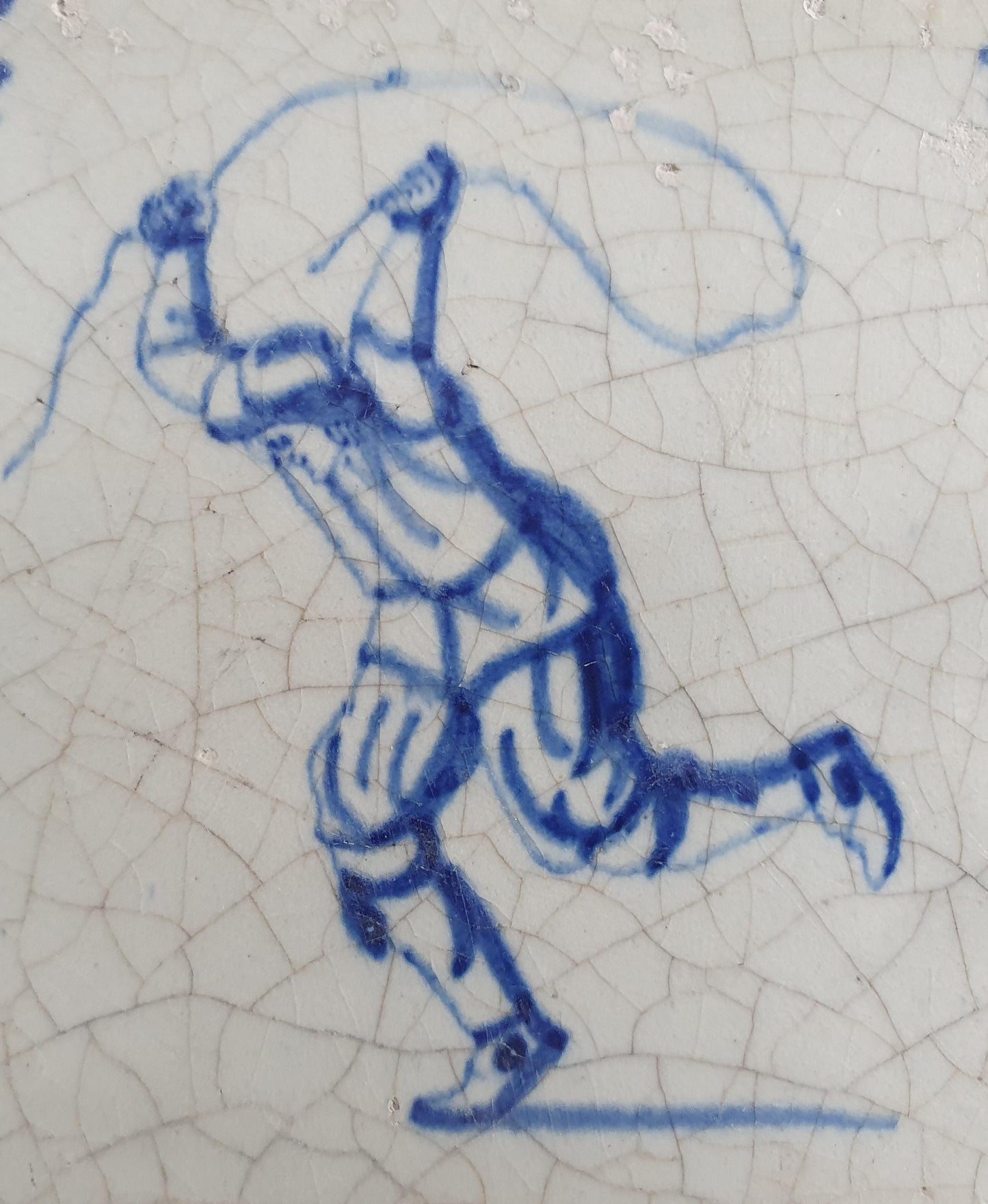 17th Delft tile was  made around 1650 and depicts a  child with a jumping rope.